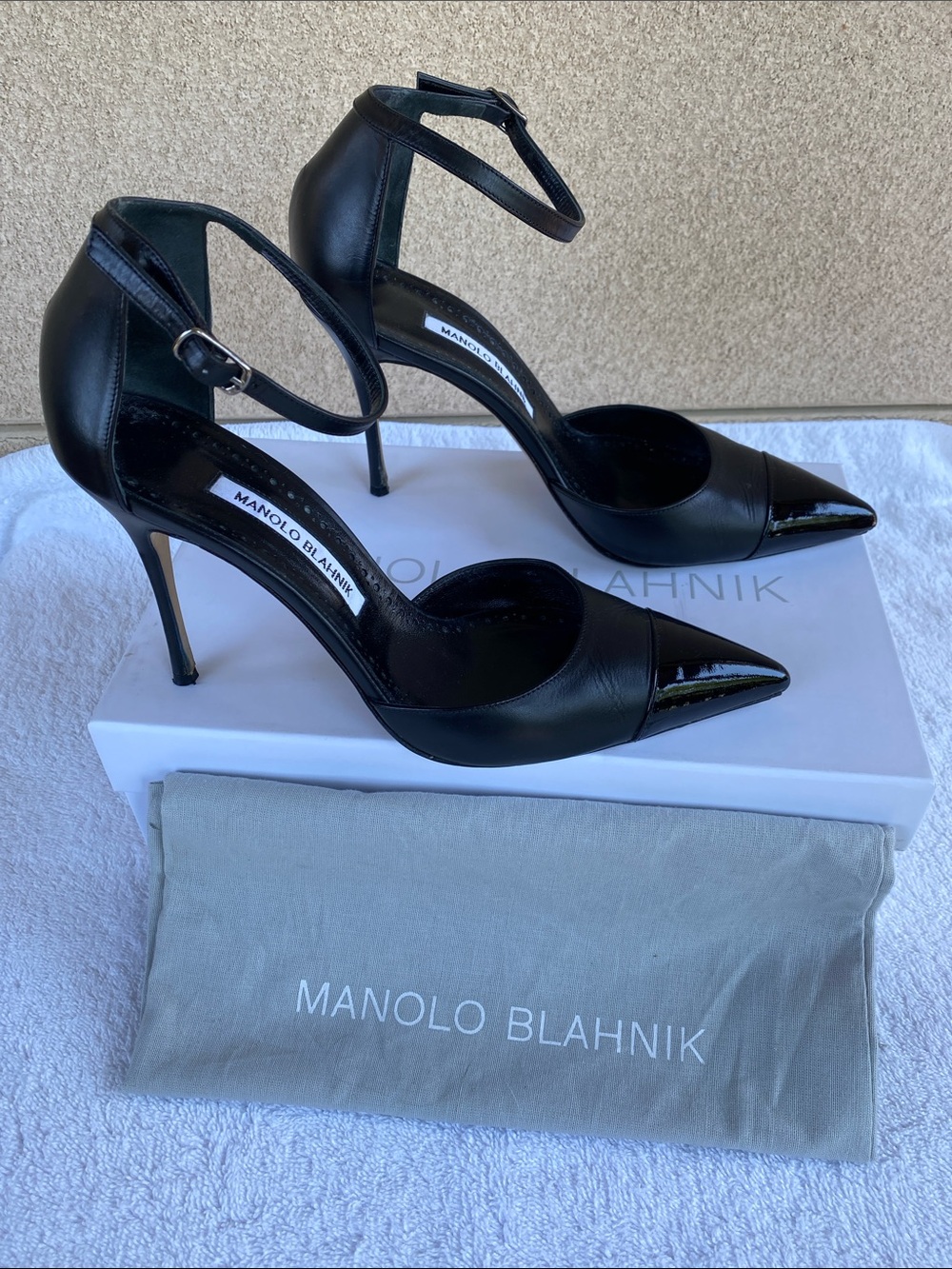 Manolo Blahnik “Trova” Black Leather Pointed-Toe Ankle-Strap Pumps